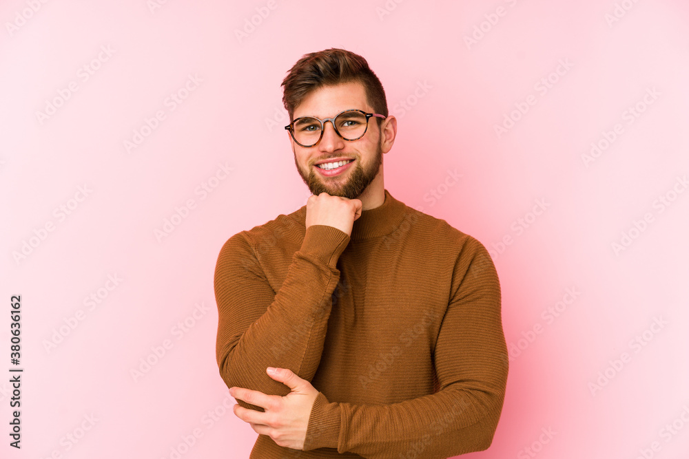 Young caucasian man isolated on pink background smiling happy and confident, touching chin with hand. Young caucasian man isolated on pink background smiling happy and confident, touching chin with hand.
