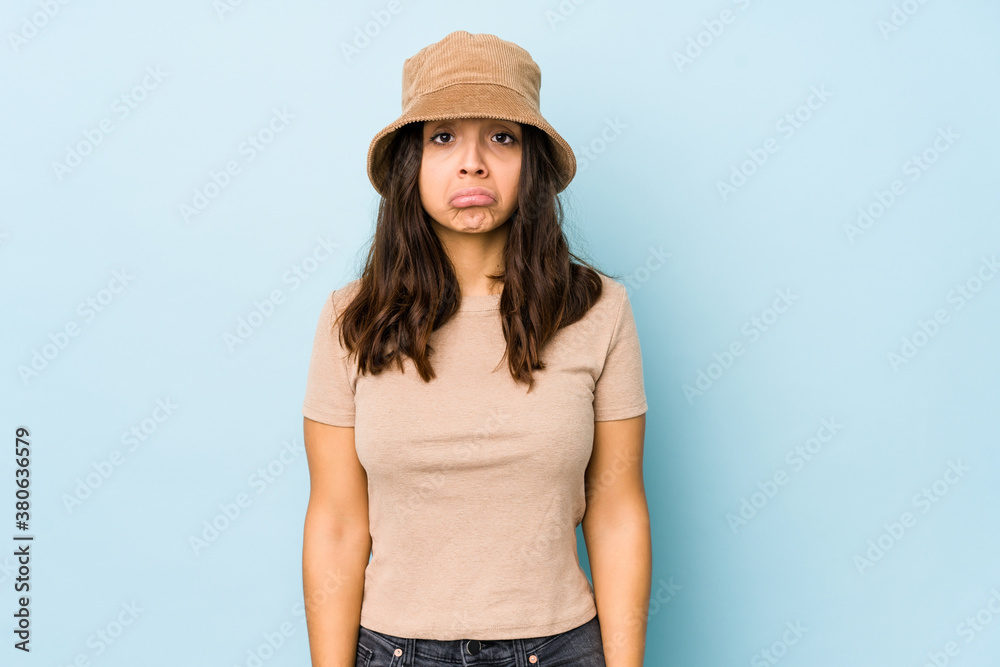 Young mixed race hispanic woman isolated blows cheeks, has tired expression. Facial expression concept. Young mixed race hispanic woman isolated blows cheeks, has tired expression. Facial expression concept.