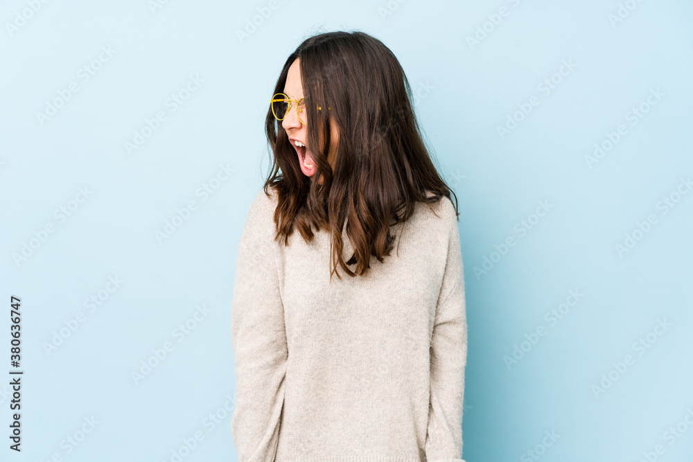 Young mixed race hispanic woman isolated shouting very angry, rage concept, frustrated. Young mixed race hispanic woman isolated shouting very angry, rage concept, frustrated.