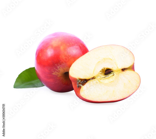 still life of two whole red apples and one cut in half on white background