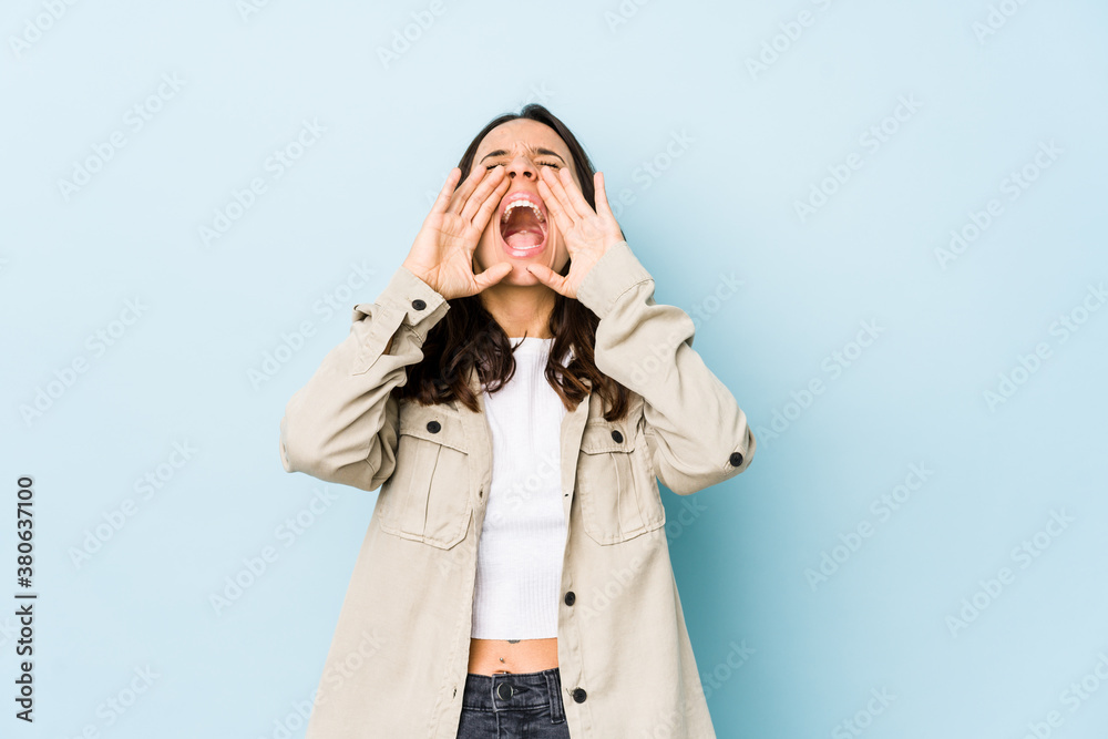 Young mixed race hispanic woman isolated shouting excited to front. Young mixed race hispanic woman isolated shouting excited to front.
