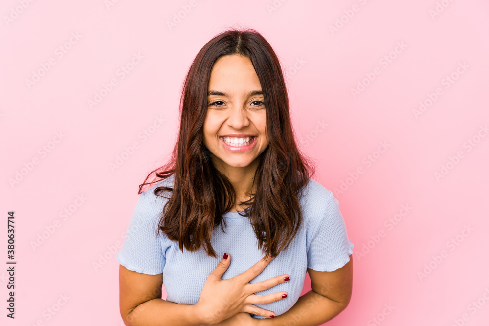 Young mixed race hispanic woman isolated laughing and having fun. Young mixed race hispanic woman isolated laughing and having fun.