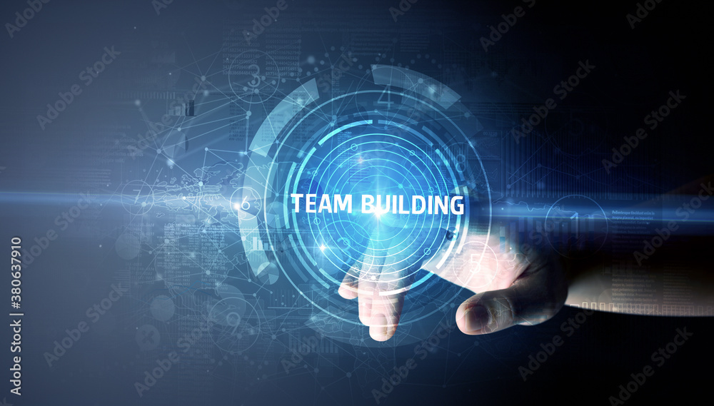 Hand touching TEAM BUILDING button, modern business technology concept Hand touching TEAM BUILDING button, modern business technology concept