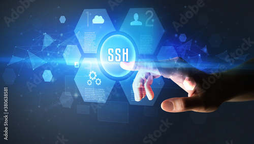 Hand touching SSH inscription, new technology concept