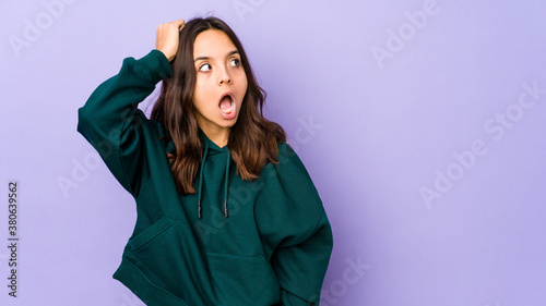 Young mixed race hispanic woman isolated being shocked, she has remembered important meeting.