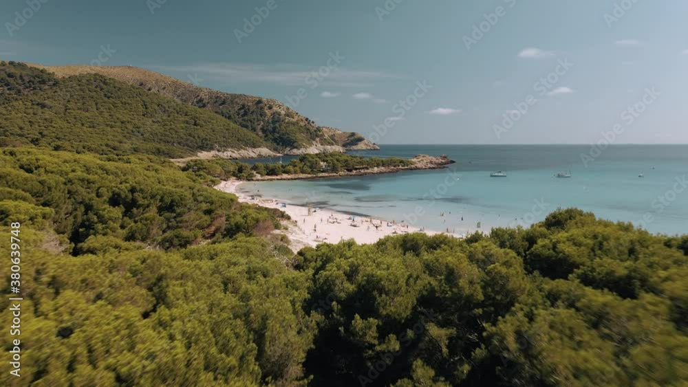 Aerial establishing shot revealing the stunning Cala Agulla, a paradise beach in Mallorca Aerial establishing shot revealing the stunning Cala Agulla, a paradise beach in Mallorca