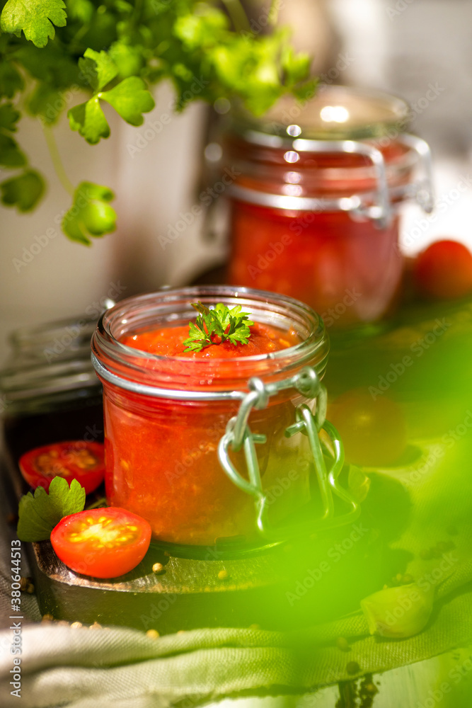 Tomato salsa in a glass jar. Tomato salsa in a glass jar.