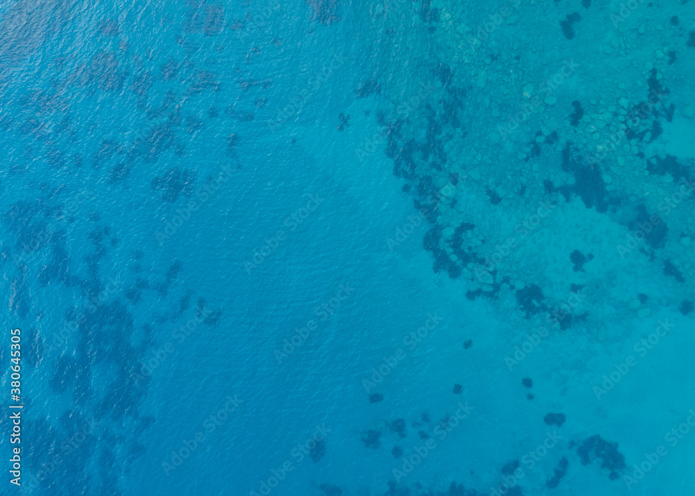 Sea water texture aerial drone view.  Clear blue water surface.
