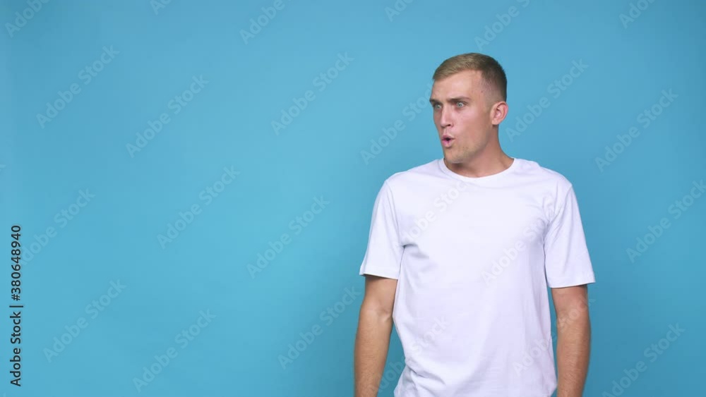 Young caucasian man being shocked because of something she has seen Young caucasian man being shocked because of something she has seen