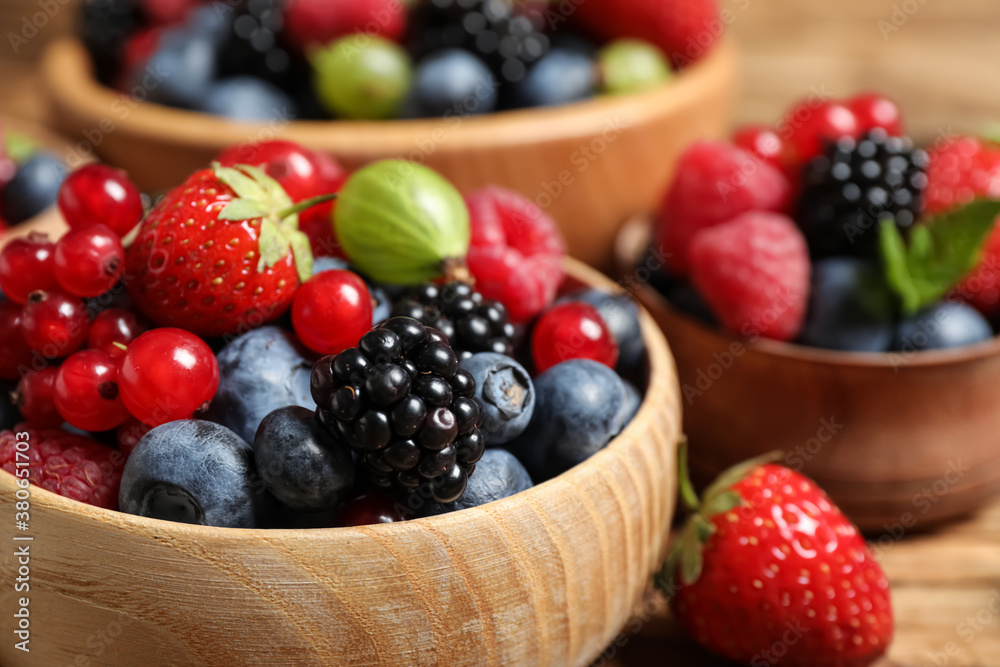 Mix of ripe berries in bowls, closeup Mix of ripe berries in bowls, closeup