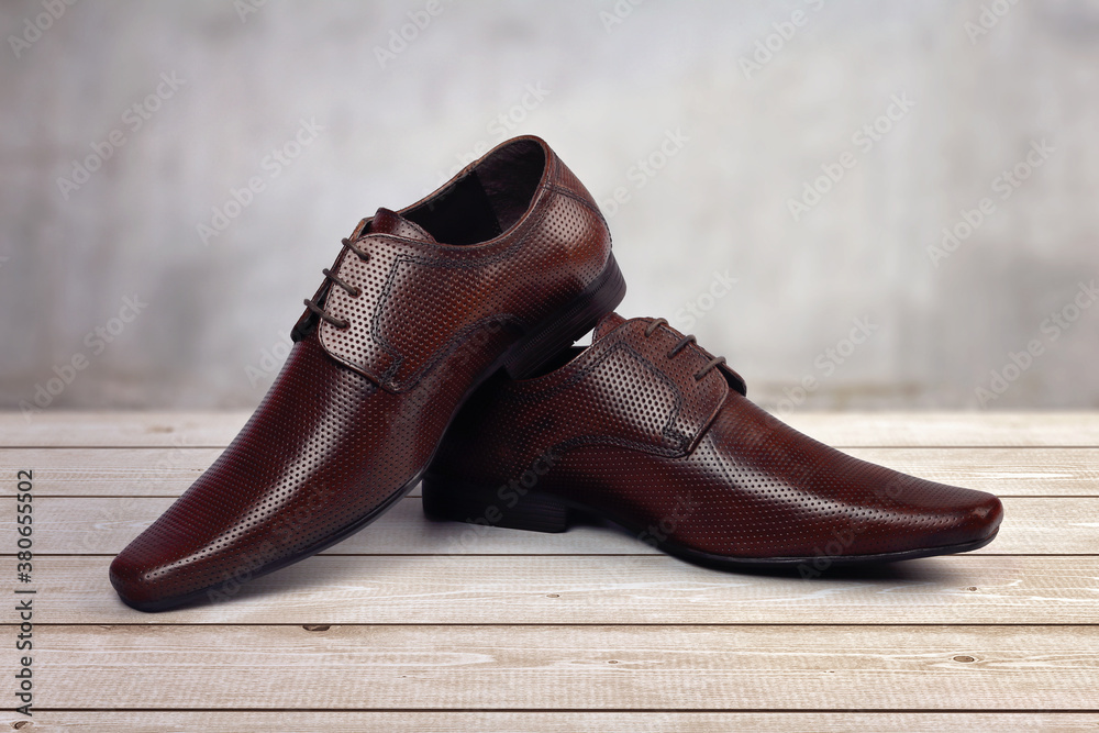 Men's formal leather Shoes isolated on wooden table
Men's formal leather Shoes isolated on wooden table
