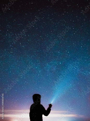 person looking at the night sky 