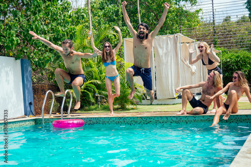 careless excited joyful sporty peoplee in swimmingpool photo