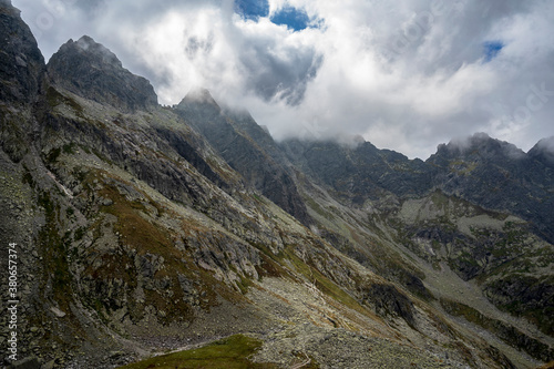 Clouds over the peaks of the High Tatras. View of the Kozia Valley. Poland.