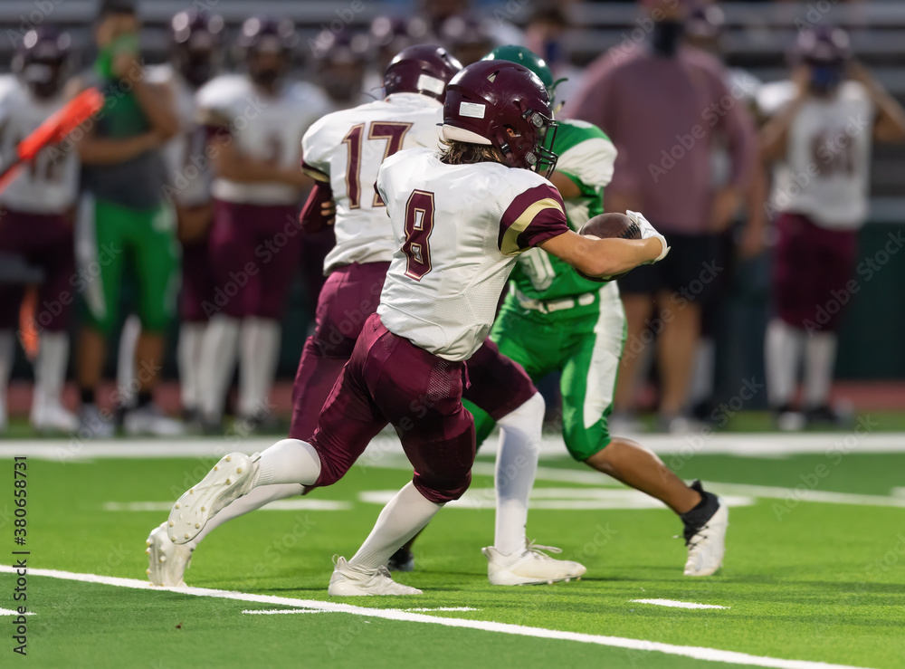 Fototapeta premium Football players making exciting plays during a game