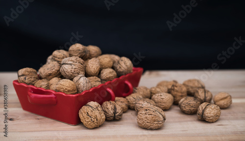 Walnuts on wooden table. Autumn harvest of nuts. 