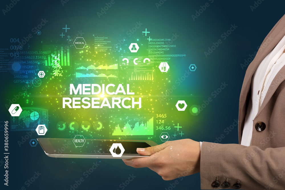 Close-up of a touchscreen with MEDICAL RESEARCH inscription, medical concept Close-up of a touchscreen with MEDICAL RESEARCH inscription, medical concept