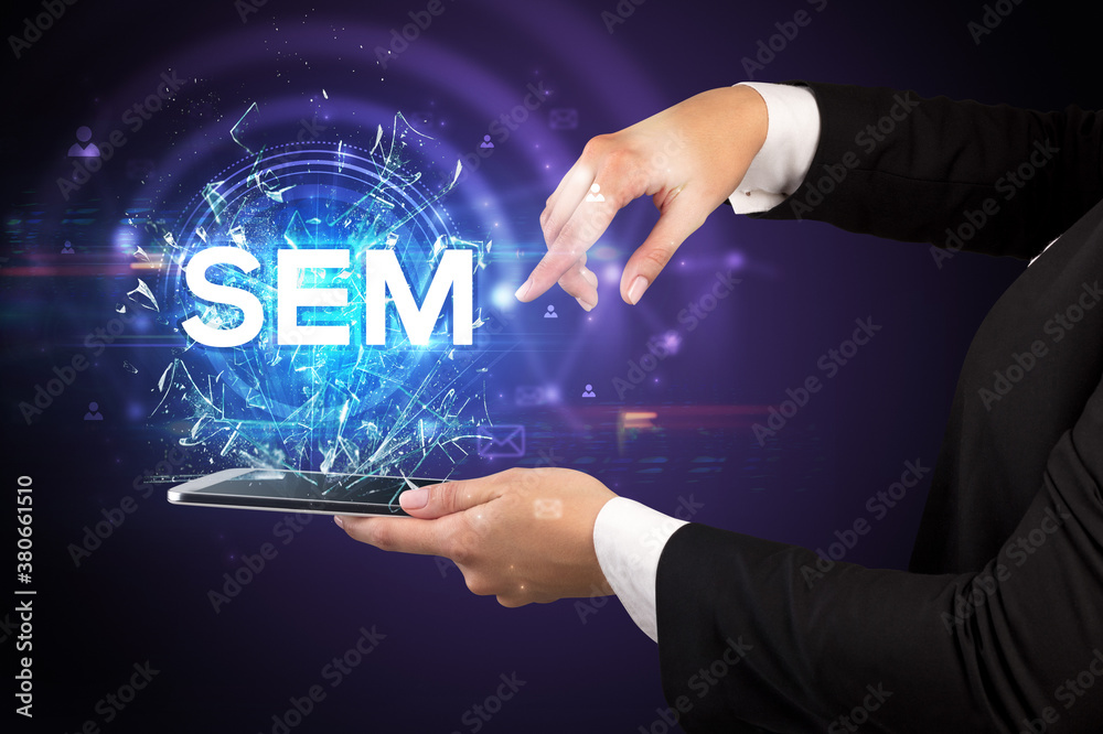Close-up of a touchscreen with SEM abbreviation, modern technology concept