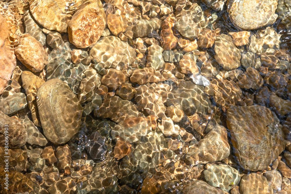 Clear water in the river and stone texture Clear water in the river and stone texture