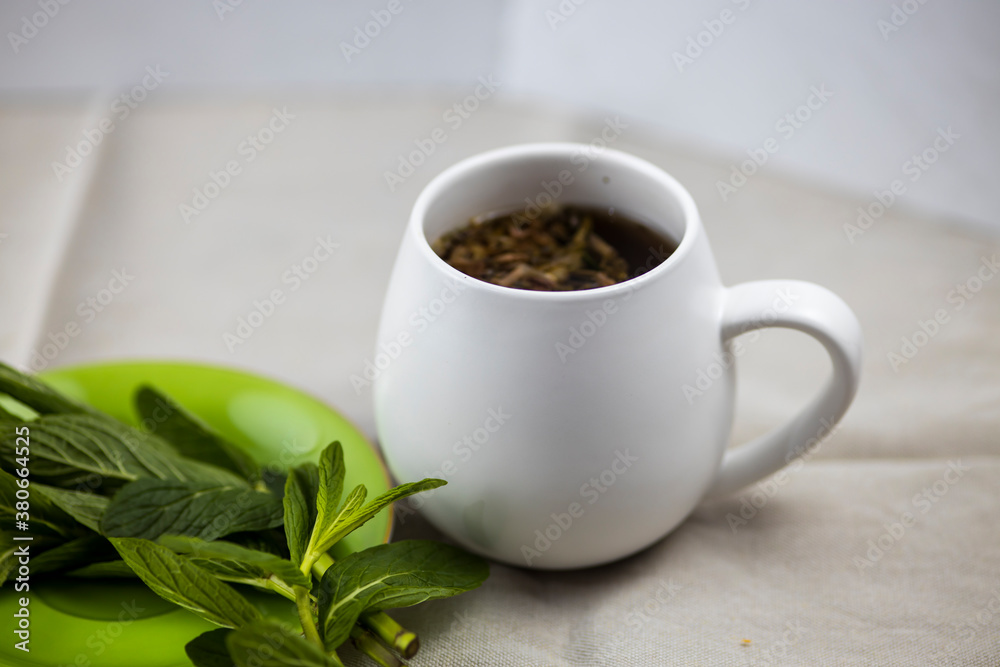 mint tea on white background with mint leaves mint tea on white background with mint leaves