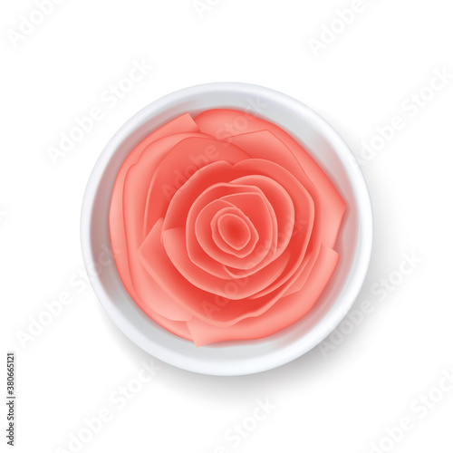 Pink pickled ginger in white bowl, sushi seasoning, Asian food, spicy marinated root.