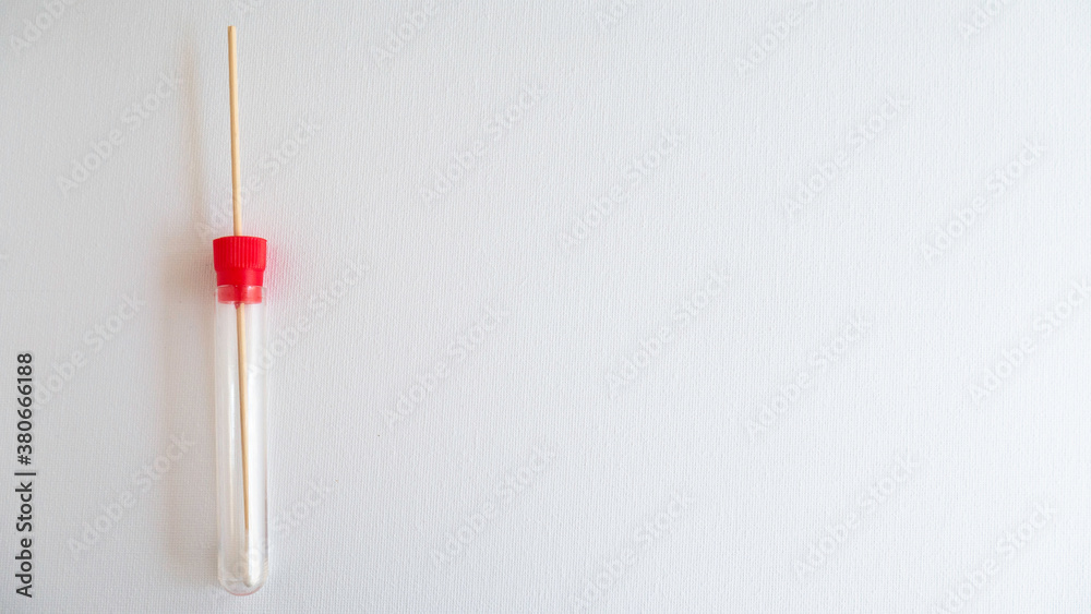 Medical swab for sampling and transporting bacteria for culture on a white background.