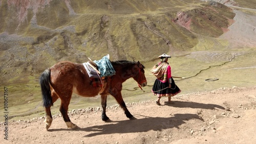 horse riding in montain  winicunca peru south america photo