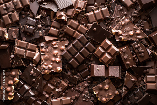 Chocolate assortment background. Top view of different kinds of chocolate