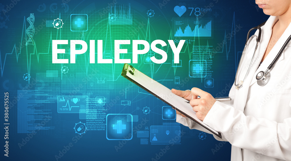 young doctor writing down notes with EPILEPSY inscription, healthcare concept young doctor writing down notes with EPILEPSY inscription, healthcare concept