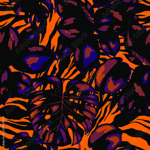 Tropical seamless pattern on animalistic texture. Jungle exotic summer print. Summer tropical leaf. Tropical flower fashion pattern. Floral tropic illustration. Vector seamless pattern.