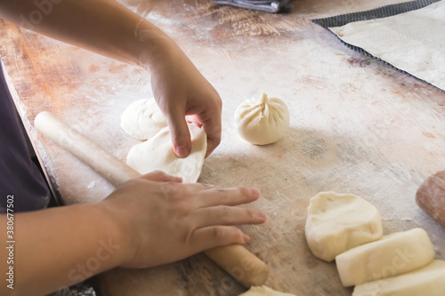 фотографія Image of making process of Chinese traditional food - baozi ( Chinese steamed buns )