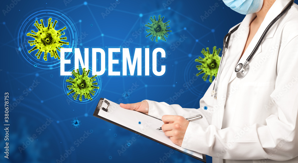 doctor prescribes a prescription with ENDEMIC inscription, pandemic concept doctor prescribes a prescription with ENDEMIC inscription, pandemic concept