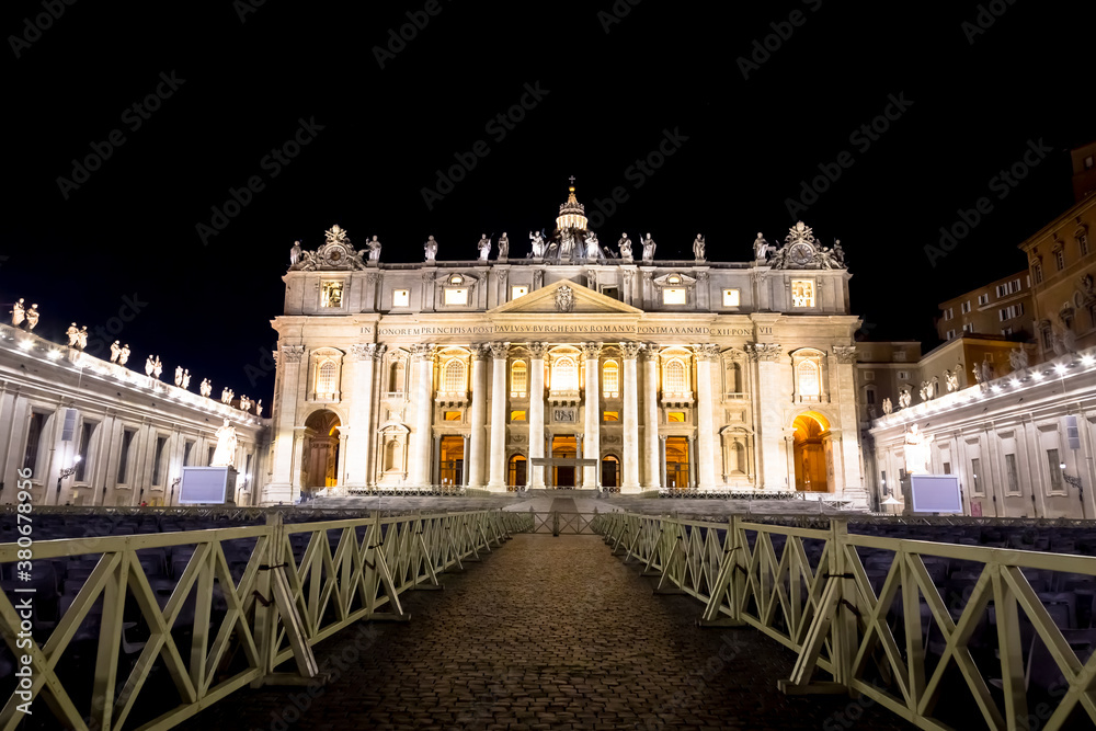 Fototapeta premium Saint Peter Basilica in Vatican City illuminated by night, masterpiece of Michelangelo and Bernini