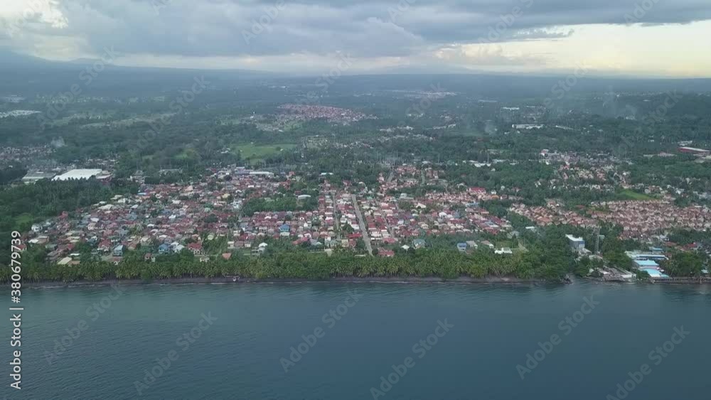 Aerial over coastal beach town in Matina, Davao City, Philippines Aerial over coastal beach town in Matina, Davao City, Philippines