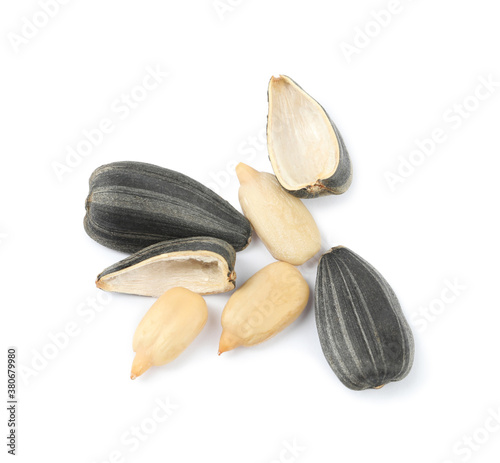 Raw peeled sunflower seeds and shell isolated on white, top view