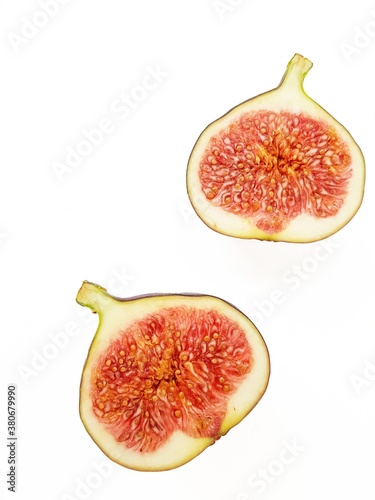 Fototapeta Naklejka Na Ścianę i Meble -  Bright juicy ripe figs on a white background.