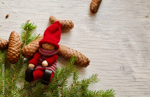 One of Santat little helpers taking a break by the Christmas tree photo