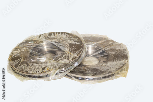 Fotografie Two brake discs on the car are packed in bags and soaked with special oil or lubricant