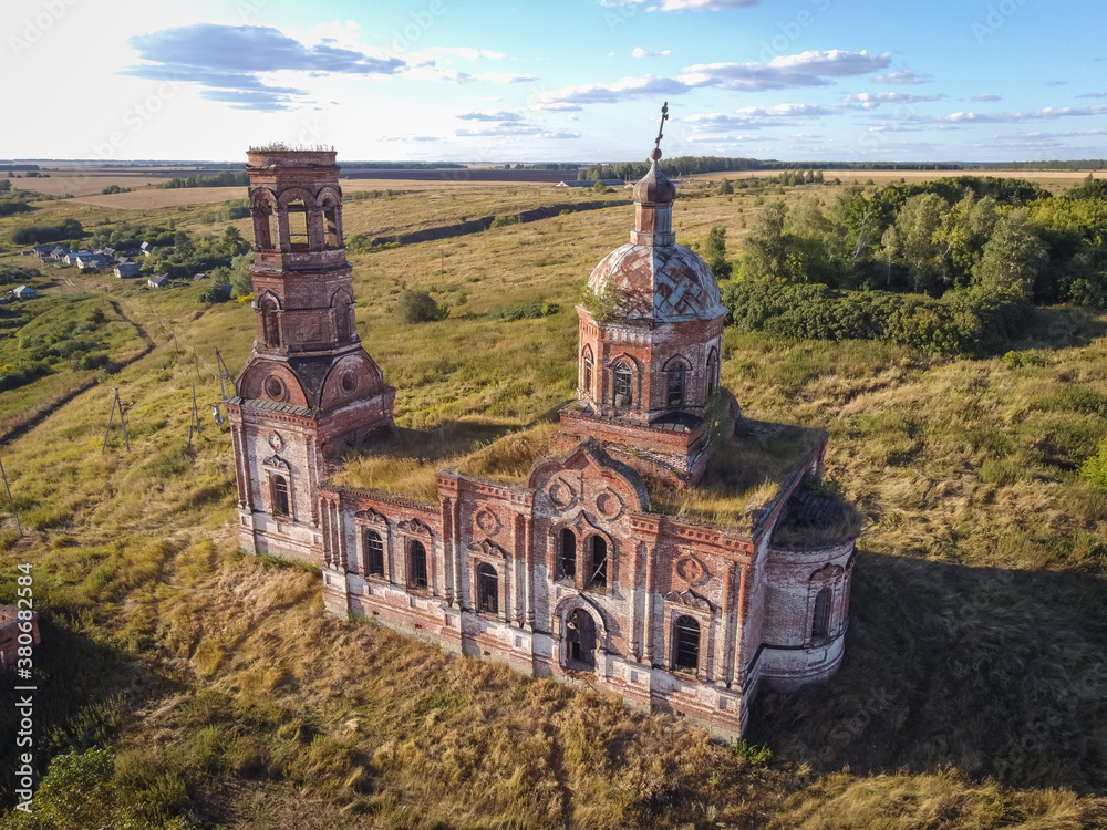 flight over an abandoned church, ancient abandoned and ruined church, dilapidated red brick temple flight over an abandoned church, ancient abandoned and ruined church, dilapidated red brick temple