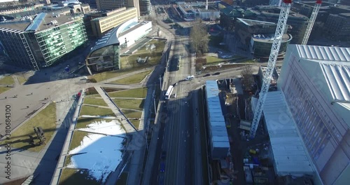 Aerial following road Mannerheimintie southwards in Helsinki, Finland, during winter. photo