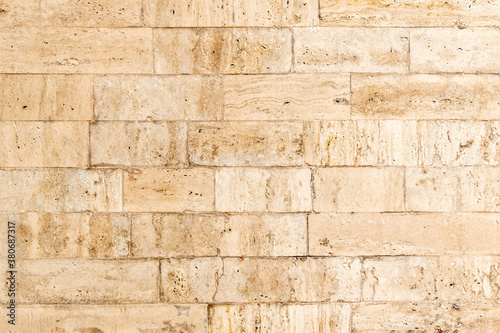 Background, texture, beige marbled brick wall