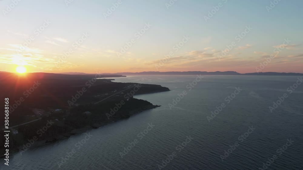 Gaspesie Peninsula On A Sunset - Scenic View By The Saint Lawrence River In Quebec, Canada - aerial drone Gaspesie Peninsula On A Sunset - Scenic View By The Saint Lawrence River In Quebec, Canada - aerial drone