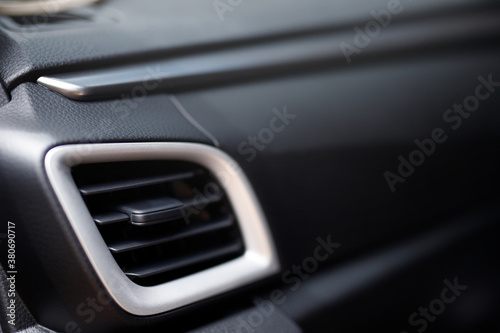 Car conditioner system. The air flow inside the Interior of a modern. ducts, deflectors on the  panel. © methaphum