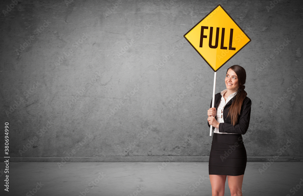 Young business person holding road sign with FULL inscription, new rules concept Young business person holding road sign with FULL inscription, new rules concept