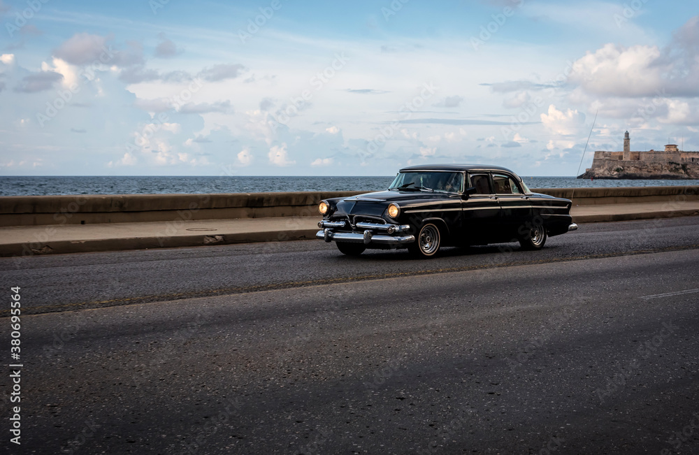 Classic car driving in La Havana, Cuba Classic car driving in La Havana, Cuba