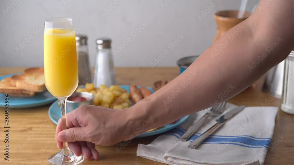 american breakfast with mimosa on wooden table top