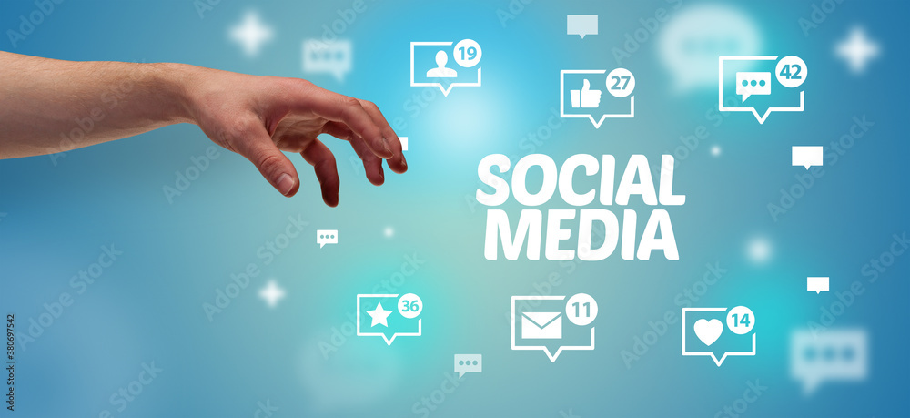 Close-Up of cropped hand pointing at SOCIAL MEDIA inscription, social networking concept Close-Up of cropped hand pointing at SOCIAL MEDIA inscription, social networking concept