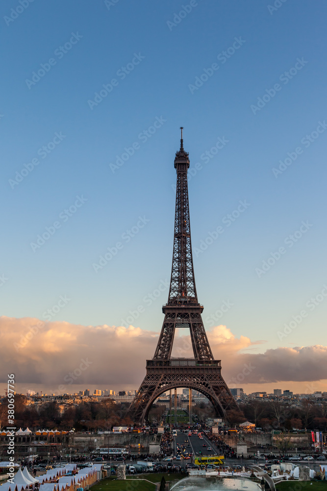 Paris cityscape with Eiffel tower at sunset, France.