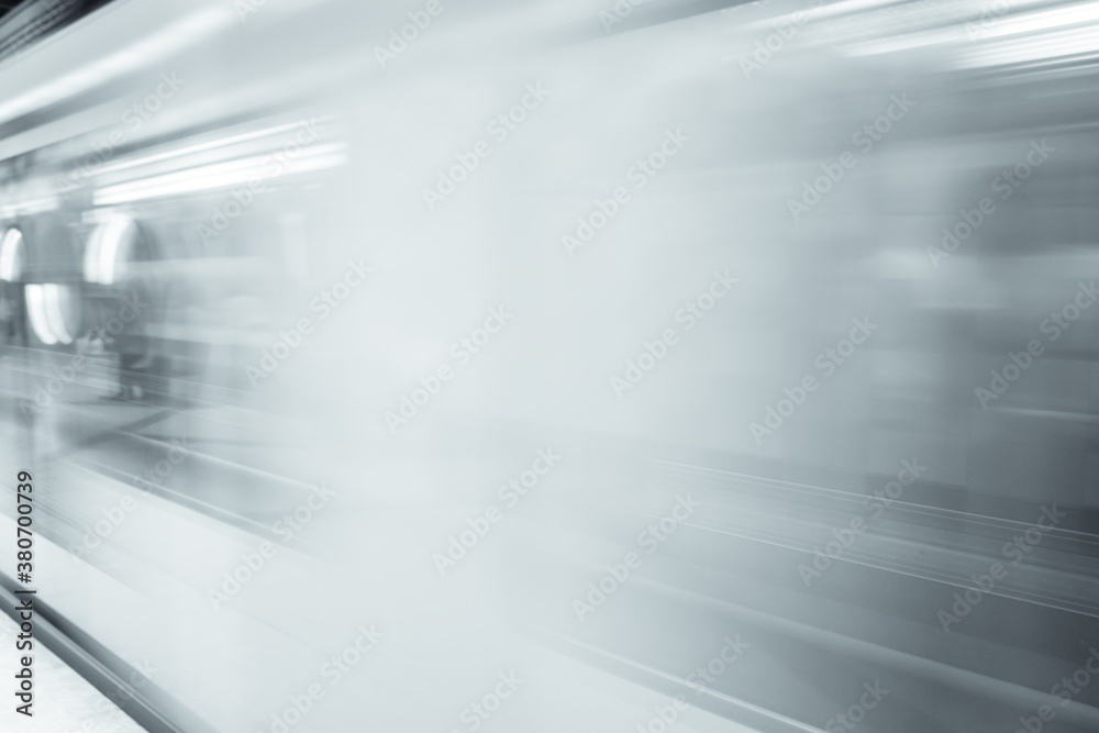 Motion blur of subway train in black and white. High speed metro in subway station. 