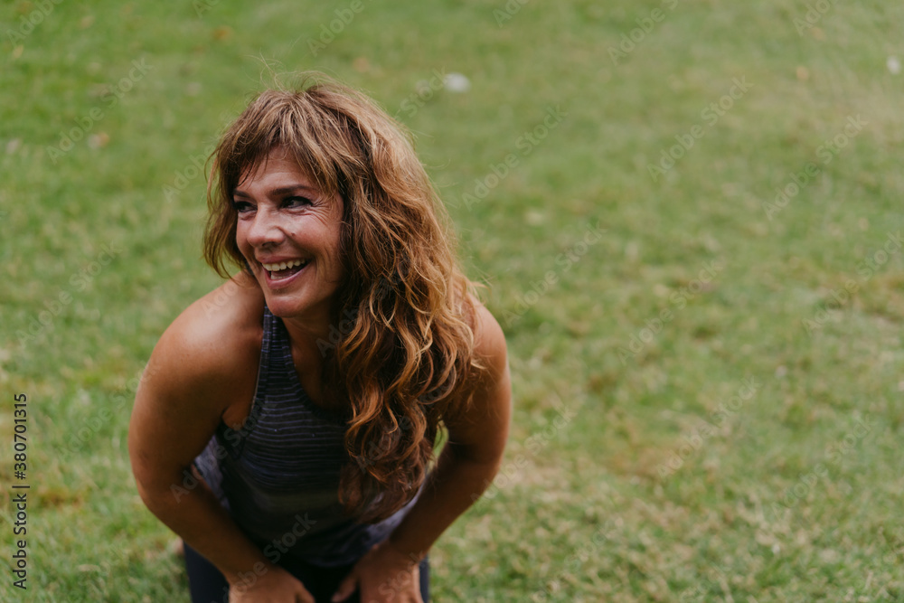 Content woman relaxing in nature. Content woman relaxing in nature.